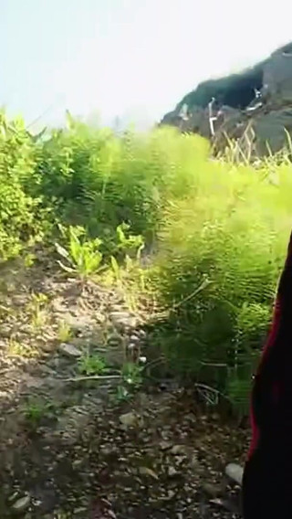 Sexy Guy on the Beach Clearing a Little