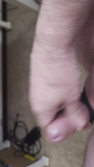 My Friend Sits in a Chair and Jerks His Cock While Watching the Video Until He Orgasms