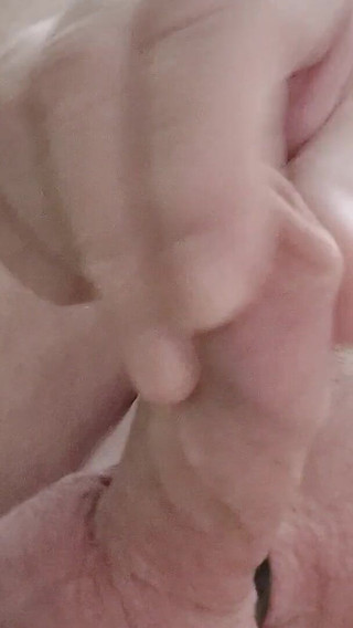 My Friend Sits in a Chair and Plays with His Little Cock and Watches Videos He Likes to Watch Videos Means He Watches Videos