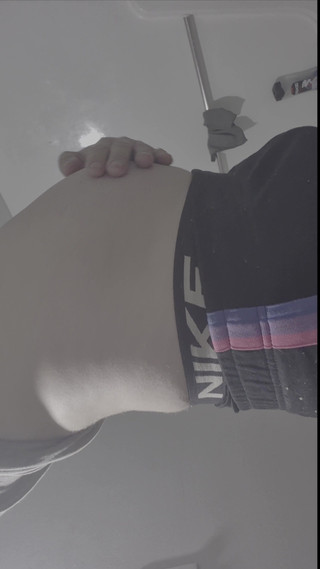 Young Man Holds a Full Bladder