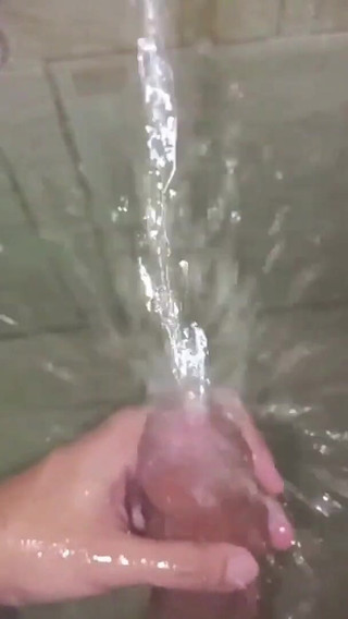 No hands water masturbation. Letting the stream of water fall on my big uncut latino cock until it makes me cum hands free ?