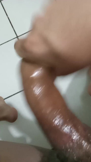 Oiled up Stroking Dick