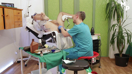 Kinky doctor stuffes ass with his hands and silicone toys