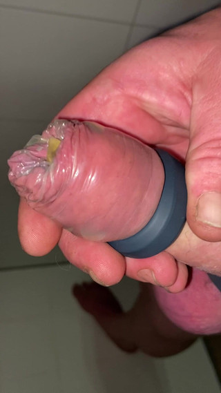 Uncut Cock with Tied Balls Pisses and Cums in Condom