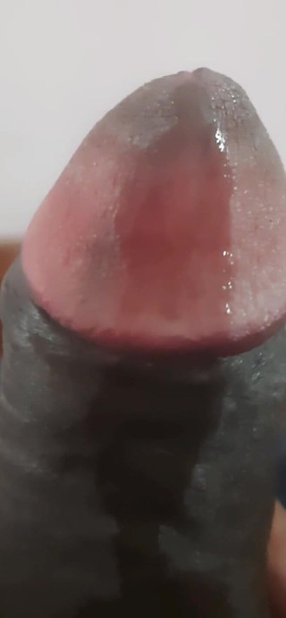 A Person Is Enjoying Some Private Time in His Bedroom.