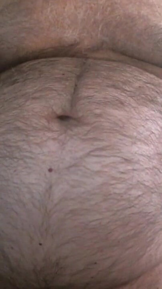 Coach Karl Shows off His Furry Belly